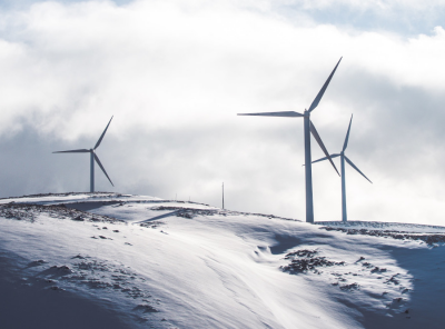 Wind turbines on a snowy mountain