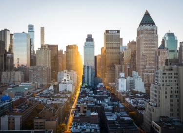 sunset over a skyscrapers and buildings